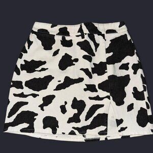 Black and white cow print mini skirt with side cut. Size Small.
